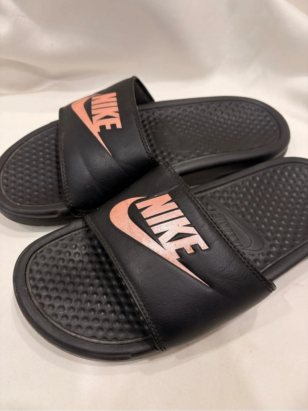 Woman’s Nike Benassi Black and Rose Gold Slides Size 7